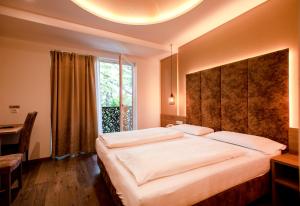 Postel nebo postele na pokoji v ubytování Hotel Chrys