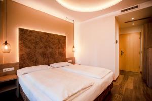 Postel nebo postele na pokoji v ubytování Hotel Chrys