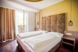 Postel nebo postele na pokoji v ubytování Hotel Chrys