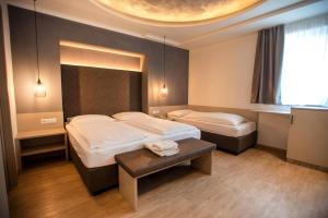 Postel nebo postele na pokoji v ubytování Hotel Chrys