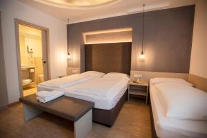 Postel nebo postele na pokoji v ubytování Hotel Chrys