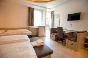 Postel nebo postele na pokoji v ubytování Hotel Chrys