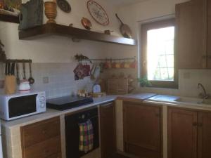 A kitchen or kitchenette at Casa Val di Rose