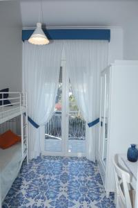 a bedroom with a bunk bed and a window at B&B Verde Smeraldo in Santa Maria La Carità