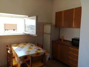A kitchen or kitchenette at Appartamenti La Balestra Még 10 kép