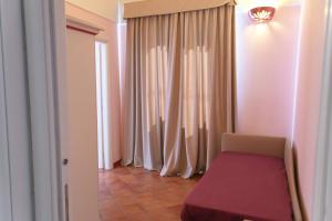 a room with a bed and a window at B&B Il Porticciolo di Amalfi in Amalfi