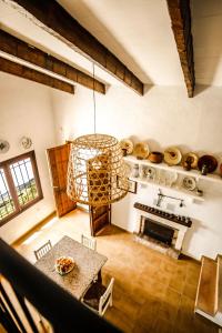 a kitchen with a chandelier and a table in a room at Finca Rural Son Rabassa in Sant Joan