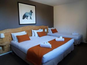 Voodi või voodid majutusasutuse Hôtel Aalborg toas