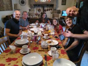 a group of people sitting around a dinner table at Four chimneys in Treffrin