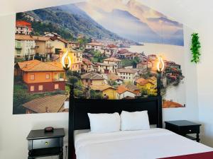 a bedroom with aamicamic view of a city at Escondido Inn in Escondido