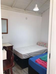 Кровать или кровати в номере Casa com piscina para família