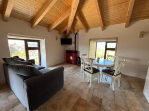 a living room with a couch and a table at Apartamentos Samitier Casa Cambra in Mediano
