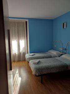 Postel nebo postele na pokoji v ubytování Albergue rural l'Almada de Yebra