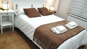 Кровать или кровати в номере VuT BALBOA APARTAMENTO