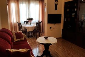 a living room with a couch and a table at Apartment at Republic Square in Yerevan