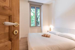 Postel nebo postele na pokoji v ubytování The Leoncino Hotel