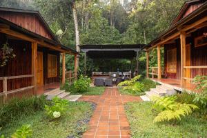 a patio with a brick walkway between two buildings at Estancia del Monje in Cob&aacute;n