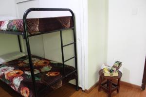 Postel nebo postele na pokoji v ubytování Hostal Cafe San Bernabe