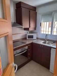 Kuchyň nebo kuchyňský kout v ubytování Ático Primera línea de playa Playa Dorada