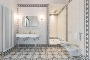 a bathroom with a sink and a toilet at Borgo Pinti Suites Le Stanze dei Nobili in Florence