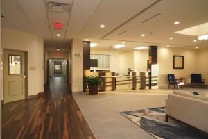 an empty lobby of a hospital with a waiting room at Candlewood Suites - Plano North by IHG in Plano