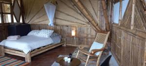 Postel nebo postele na pokoji v ubytování Ecohotel Soplo del Tambo
