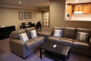 a living room with a couch and a table at Bright Chalet in Bright