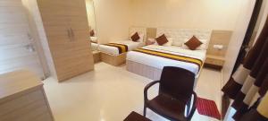 Ein Bett oder Betten in einem Zimmer der Unterkunft Sanjog Resort