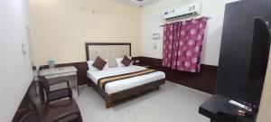 Ein Bett oder Betten in einem Zimmer der Unterkunft Sanjog Resort