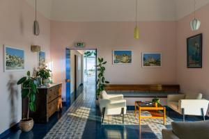 a living room with a couch and a table at Hotel Bellavista in Anacapri