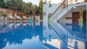 a swimming pool with blue water in a house at Sunset Villa Hotel in Kaş