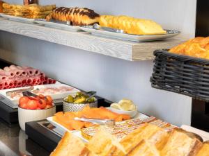 a buffet of food with bread and other foods at Montfleuri in Paris