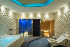 a large bathroom with a tub and a shower at Torre Cintola Greenblu Sea Emotions in Monopoli