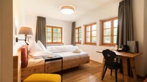 A bed or beds in a room at Natura Boutique Chalet Wellness SPA
