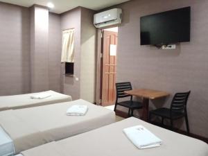 Postel nebo postele na pokoji v ubytování AB Star Suites