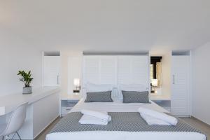 Posteľ alebo postele v izbe v ubytovaní Regal Residence
