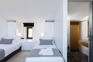 Posteľ alebo postele v izbe v ubytovaní Regal Residence