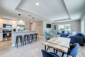 a living room with a couch and a table at AMI Gulf Lookout-Views Of The Gulf From Every Room-Rooftop Terrace in Bradenton Beach