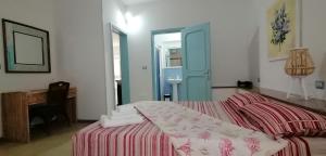 Postel nebo postele na pokoji v ubytování I Mirti - Home Holiday