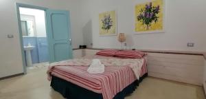 Postel nebo postele na pokoji v ubytování I Mirti - Home Holiday