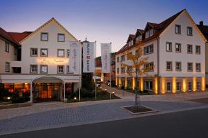a group of buildings on a street in a city at Hotel-Restaurant Anne-Sophie in Künzelsau