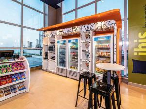 a food stand in a store with refrigerators at Ibis Budget Fortaleza Praia de Iracema in Fortaleza