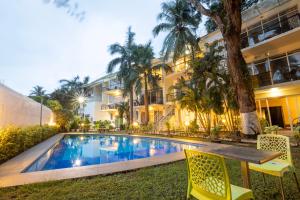 Πισίνα στο ή κοντά στο Sharanam Green Resort