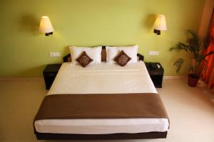 Ένα ή περισσότερα κρεβάτια σε δωμάτιο στο The Ocean Park Beach Resort