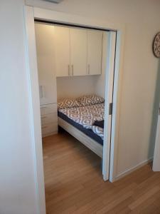 a bedroom with a bed inside of a closet at Apartman Bruna in Zagreb