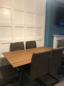 a conference room with a wooden table and chairs at 6 Eyre Square Lane in Galway