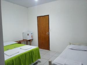 Postel nebo postele na pokoji v ubytování Chacara Cabana dos Lagos