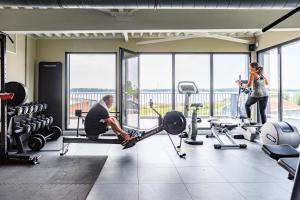 a man and a woman in a gym at RCN Vakantiepark de Schotsman Bungalow de Boei in Kamperland