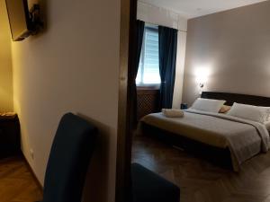 A bed or beds in a room at I Tre marchi Rooms / Camera Mare