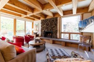 a living room filled with furniture and a fireplace at Treetops Access to Eagle Bahn Gondola in Vail